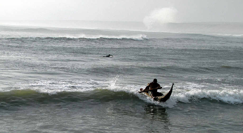 LEFT: The writer with Felipe Pomar (right). ABOVE: Riding the waves.